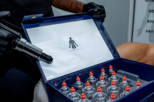 A sports massage therapist showing dry cupping cups in Cape Town. Kaapstad, 8005